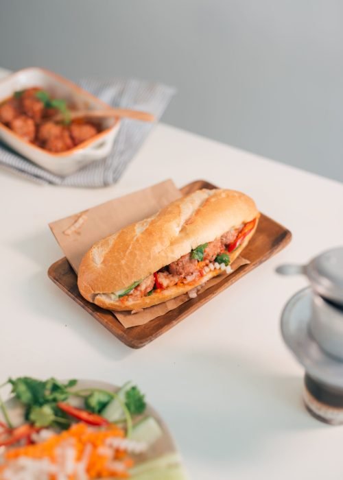 banh-mi-xiu-mai-is-popular-pork-ball-sandwich-with-tomato-sauce-vietnam (1) (1)